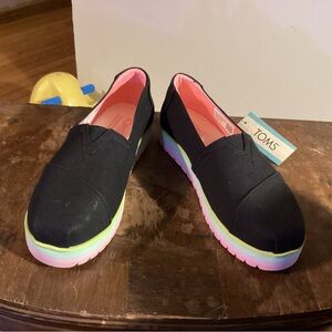 TOMS Black Slip-Ons with Neon Soles